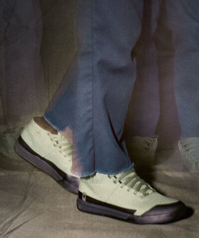 Speedframe bike helmet floating with vegetation in the back